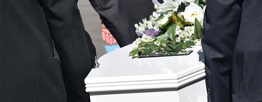 People carrying funeral coffin