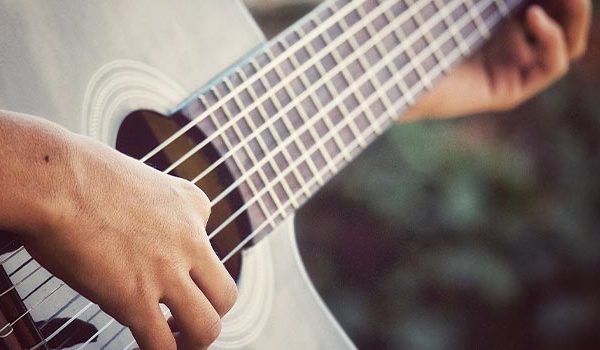 Person playing classical guitar