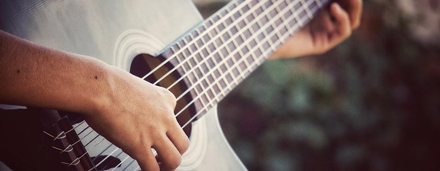 Person playing classical guitar