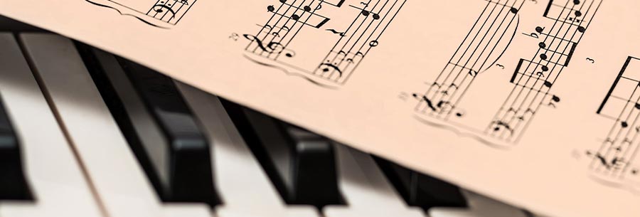 Sheet music resting on top of a piano