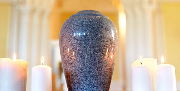 Urn sitting on a table in a well lit room