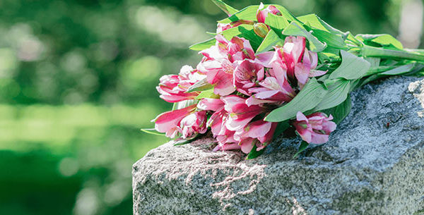 Flowers laying on headstone