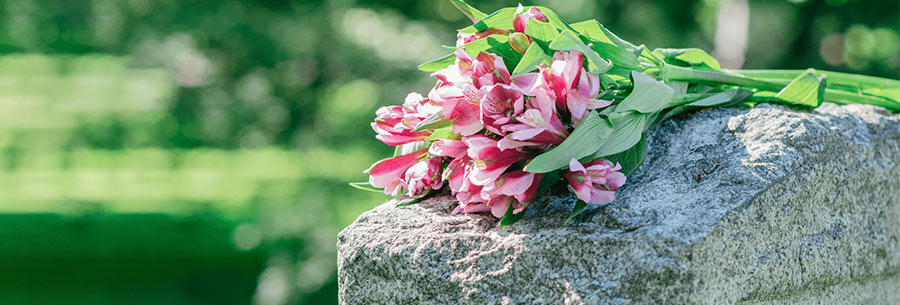 Flowers laying on headstone