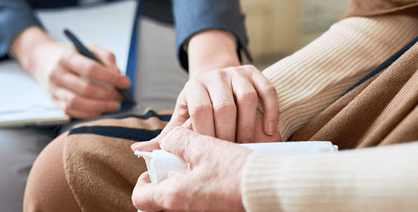 Person helping someone prepare for funeral