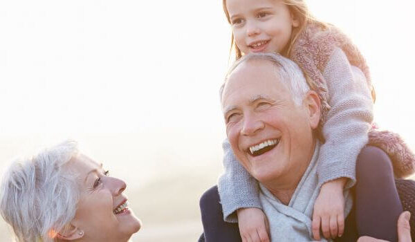 grandparents with their granddaughter