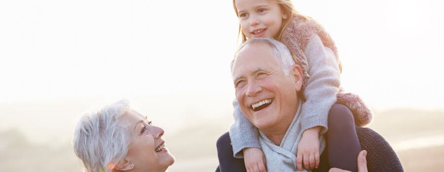 grandparents with their granddaughter