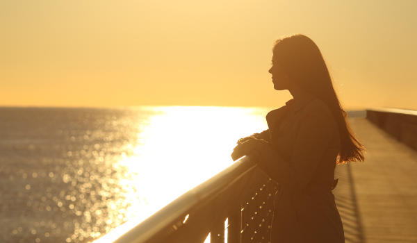 sad woman by the ocean