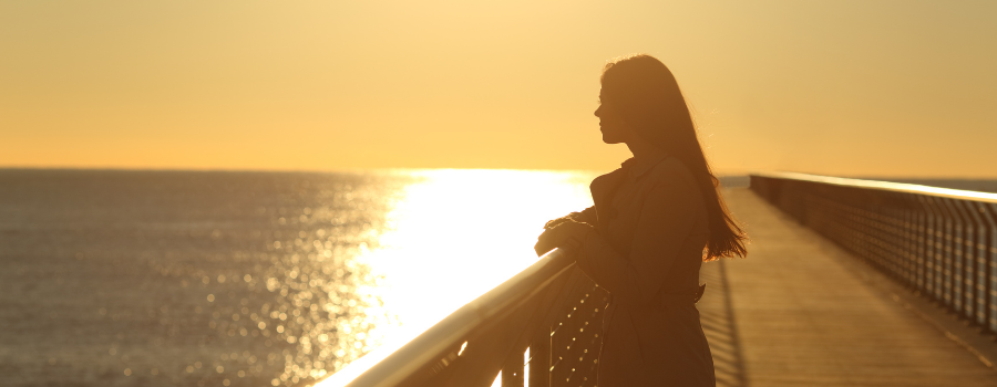 sad woman by the ocean