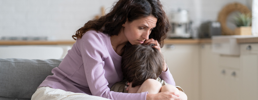 adult comforting a grieving child