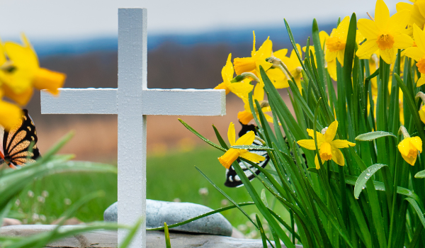 white cross with yellow flowers