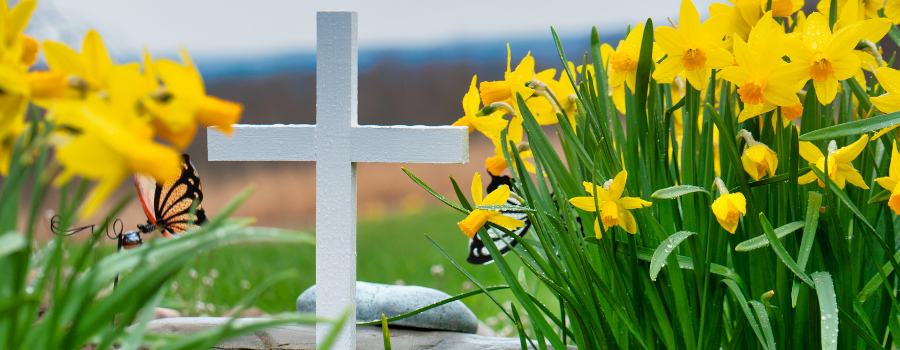 white cross with yellow flowers