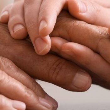 hospice care holding hands