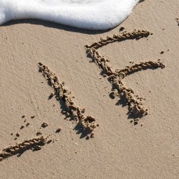 celebration of life life written in sand